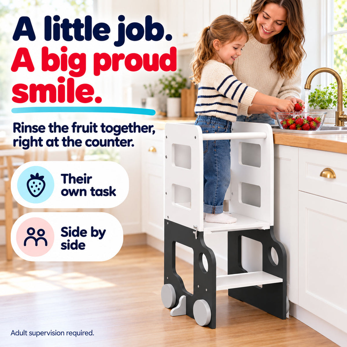 Child rinsing fruit with parent alongside using the white and charcoal learning tower