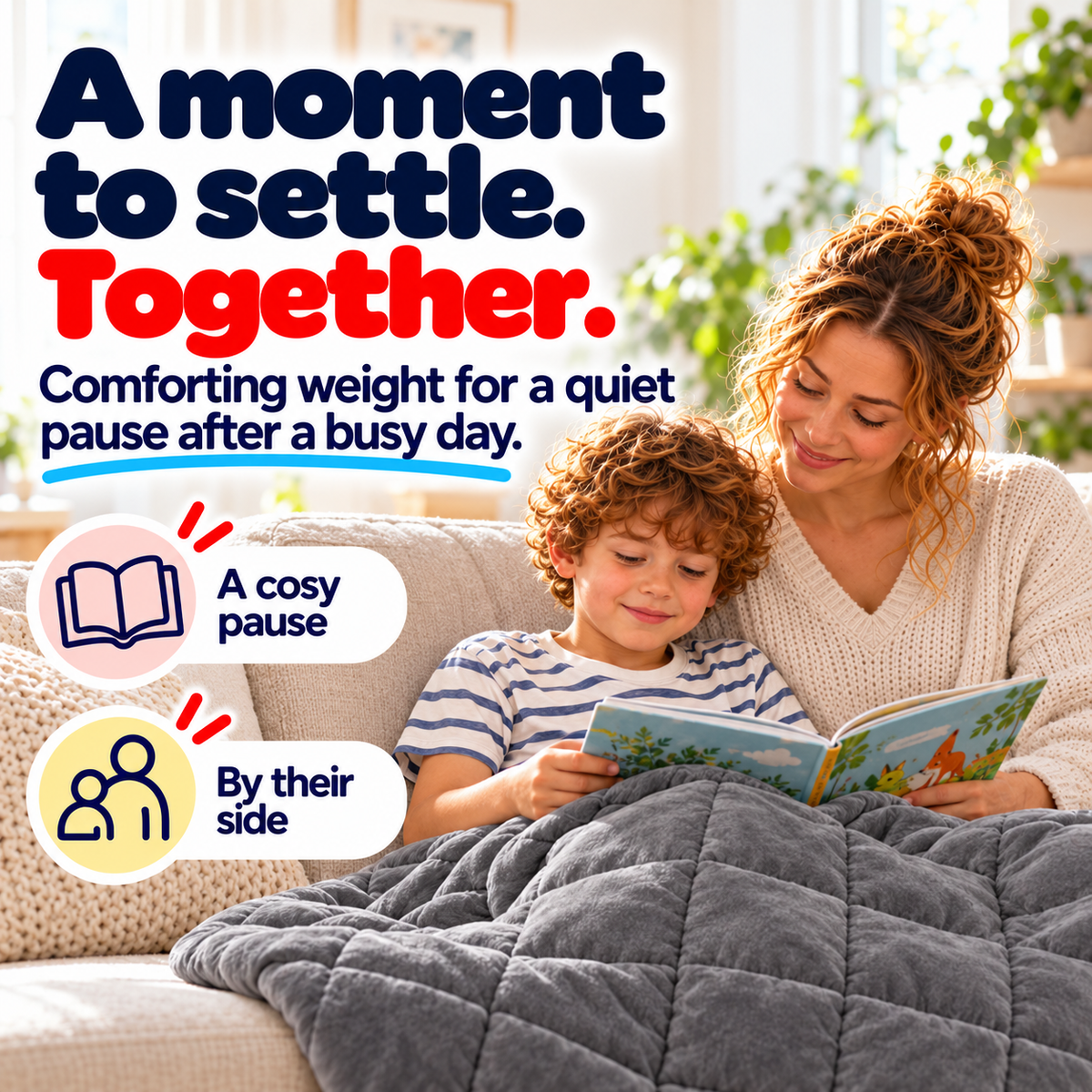 Parent and child reading together with a grey quilted blanket over the child's legs