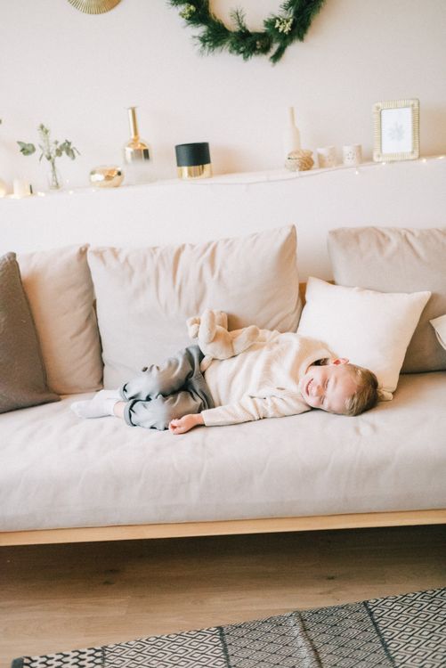 Child resting on a sofa after a demanding day