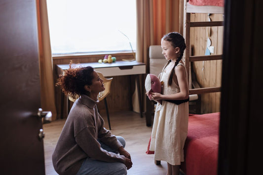 Parent speaking calmly with a child at home