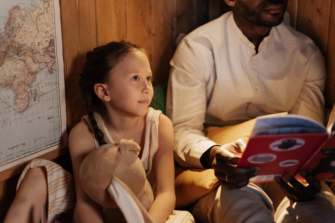 Parent reading with a child as part of a calm bedtime routine