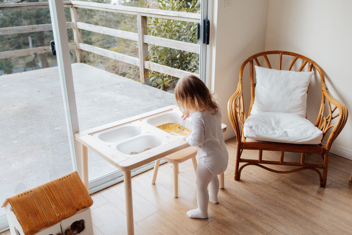 Child exploring a sensory activity at home