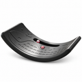Black wobble balance board with ball on a white background